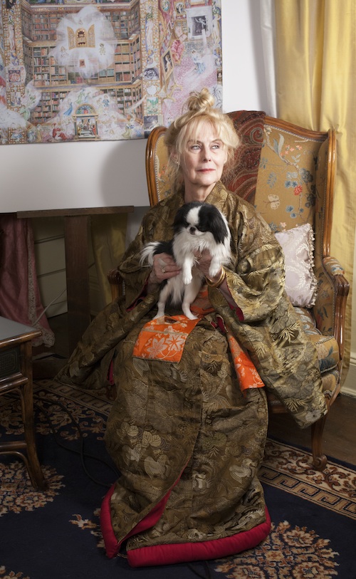 Claire Khalil in 2015, New York City with â€˜The House of Morgan II - The J.P. Morgan Library and his Collection' 
and her Japanese Chin, Johnny Valentine.Photography by Malcolm Varon